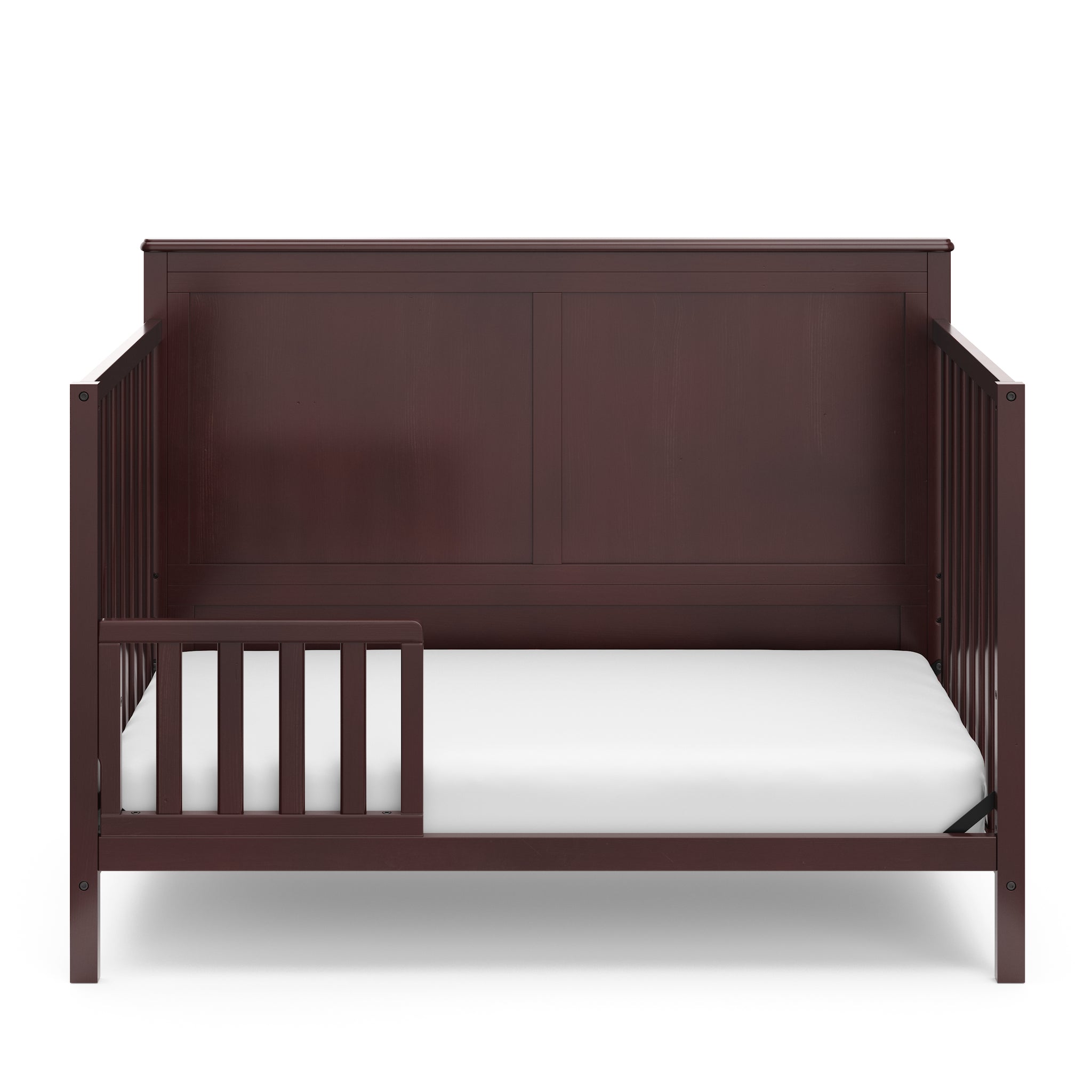 espresso crib in toddler bed conversion with one safety guardrail