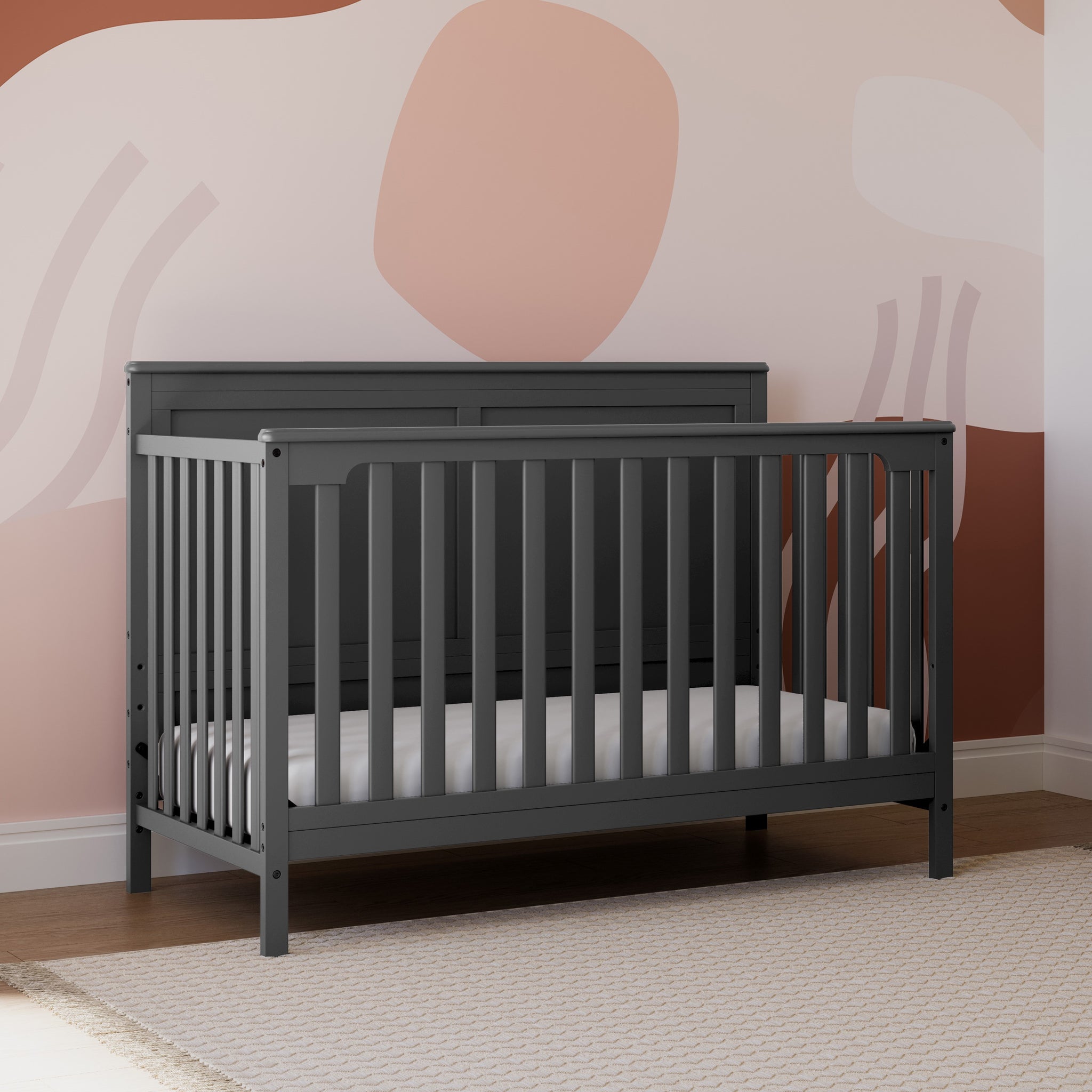 gray crib in nursery