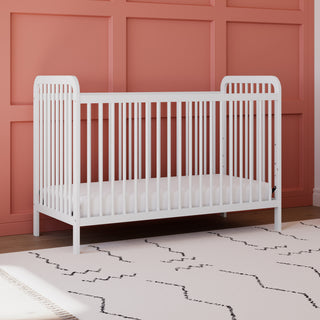 White crib in nursery 