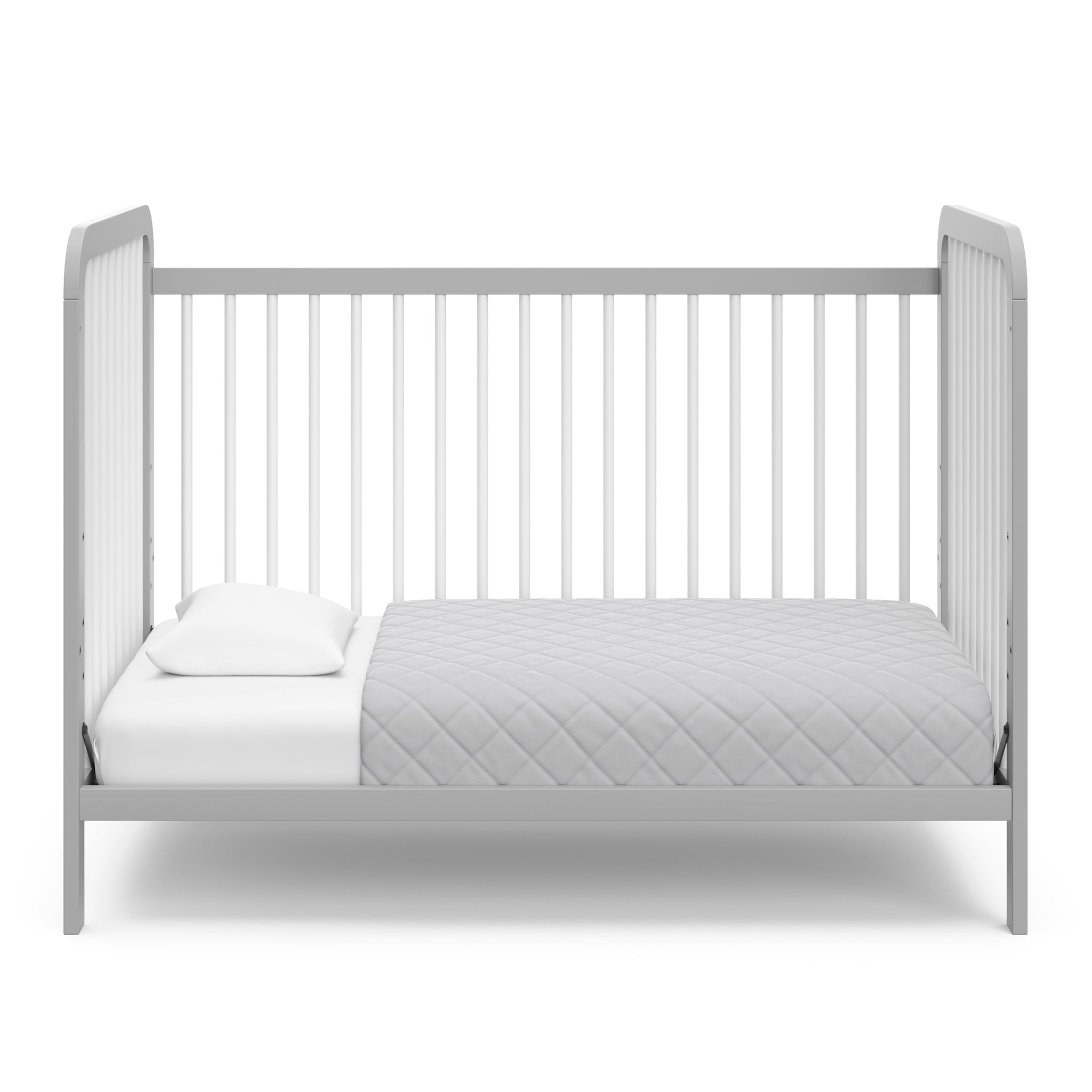White crib with pebble gray in toddler bed conversion