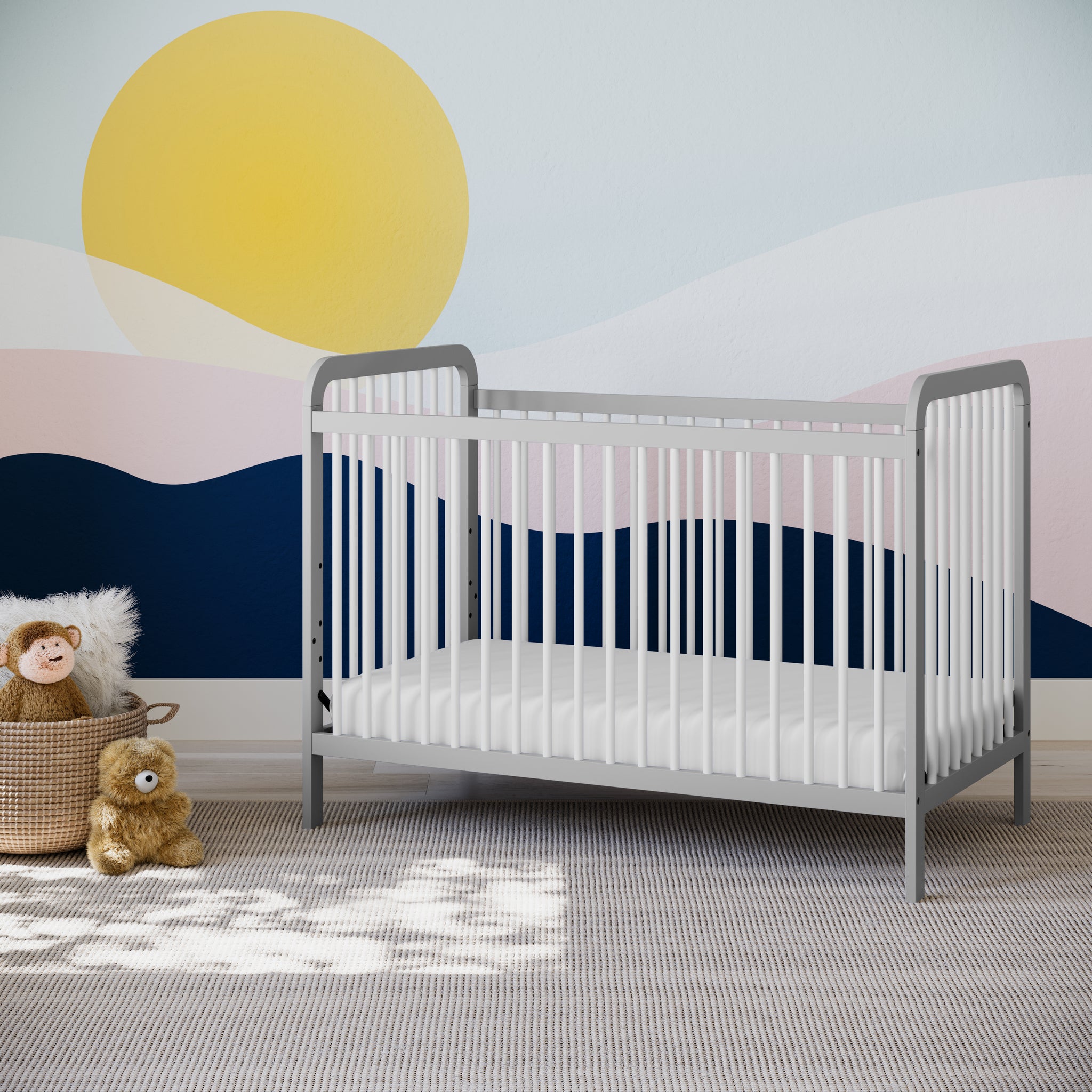 white crib with pebble gray in nursery
