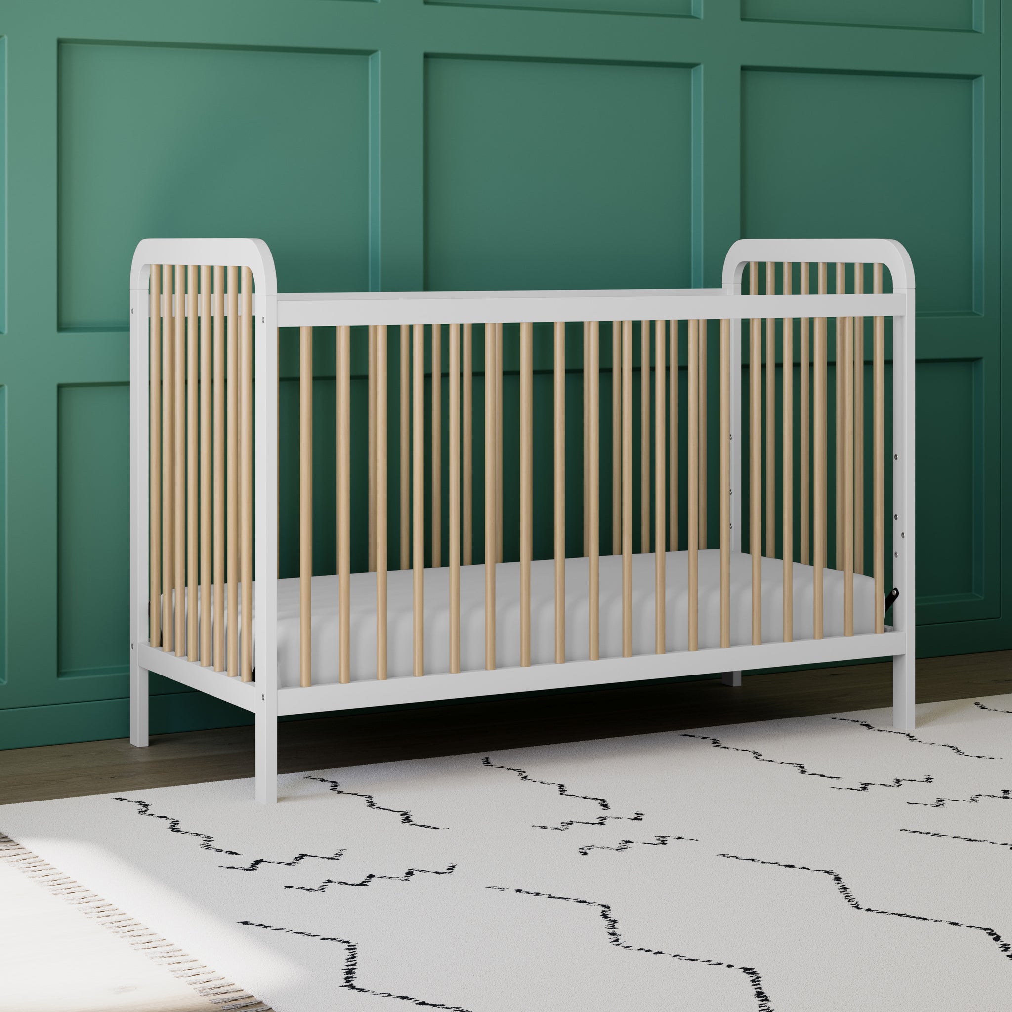 white crib with driftwood in nursery 