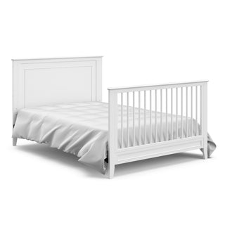 White crib in full-size bed with headboard and footboard conversion 