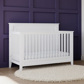 White crib in nursery 