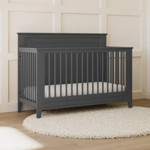 gray crib in nursery 