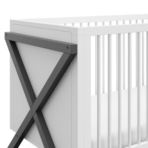 close-up view of white and gray crib's side