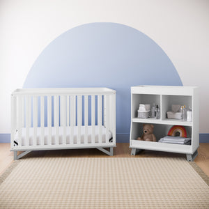 Pebble gray changing table with storage in nursery with crib