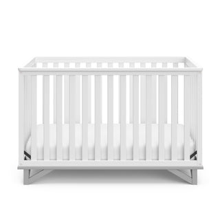 Front view of white crib with pebble gray 