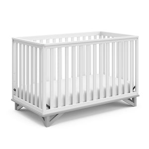 white crib with pebble gray angled 