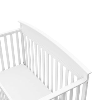 Close-up view of white crib