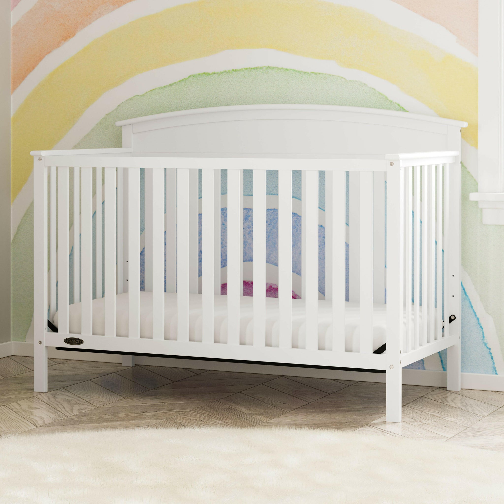 White crib in nursery