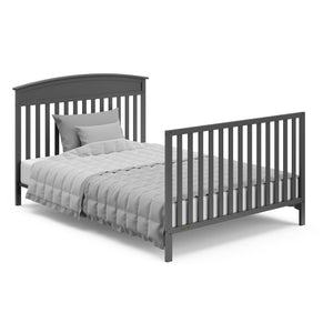 gray crib in full-size bed with headboard and footbaord conversion