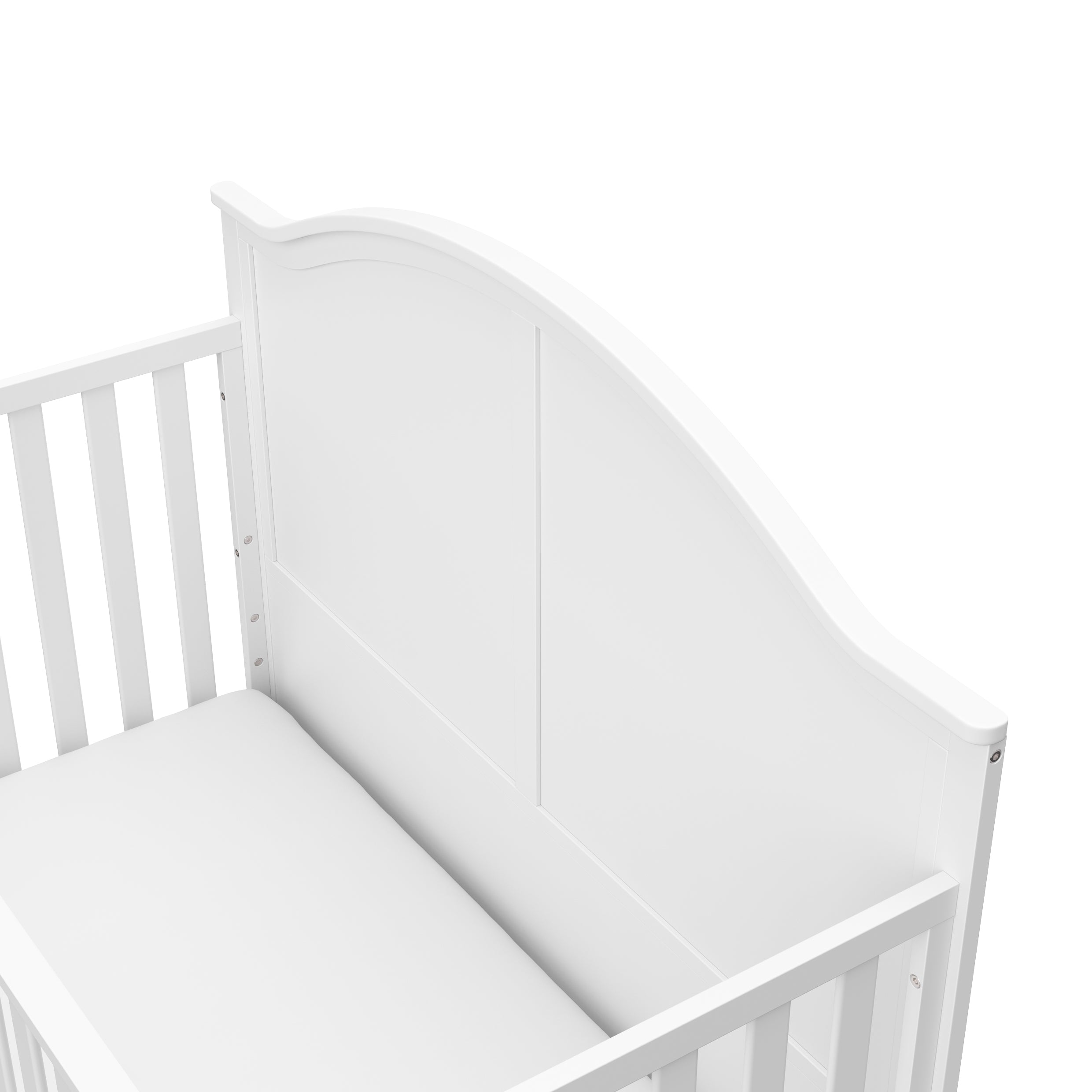 Close-up view of white crib's headboard