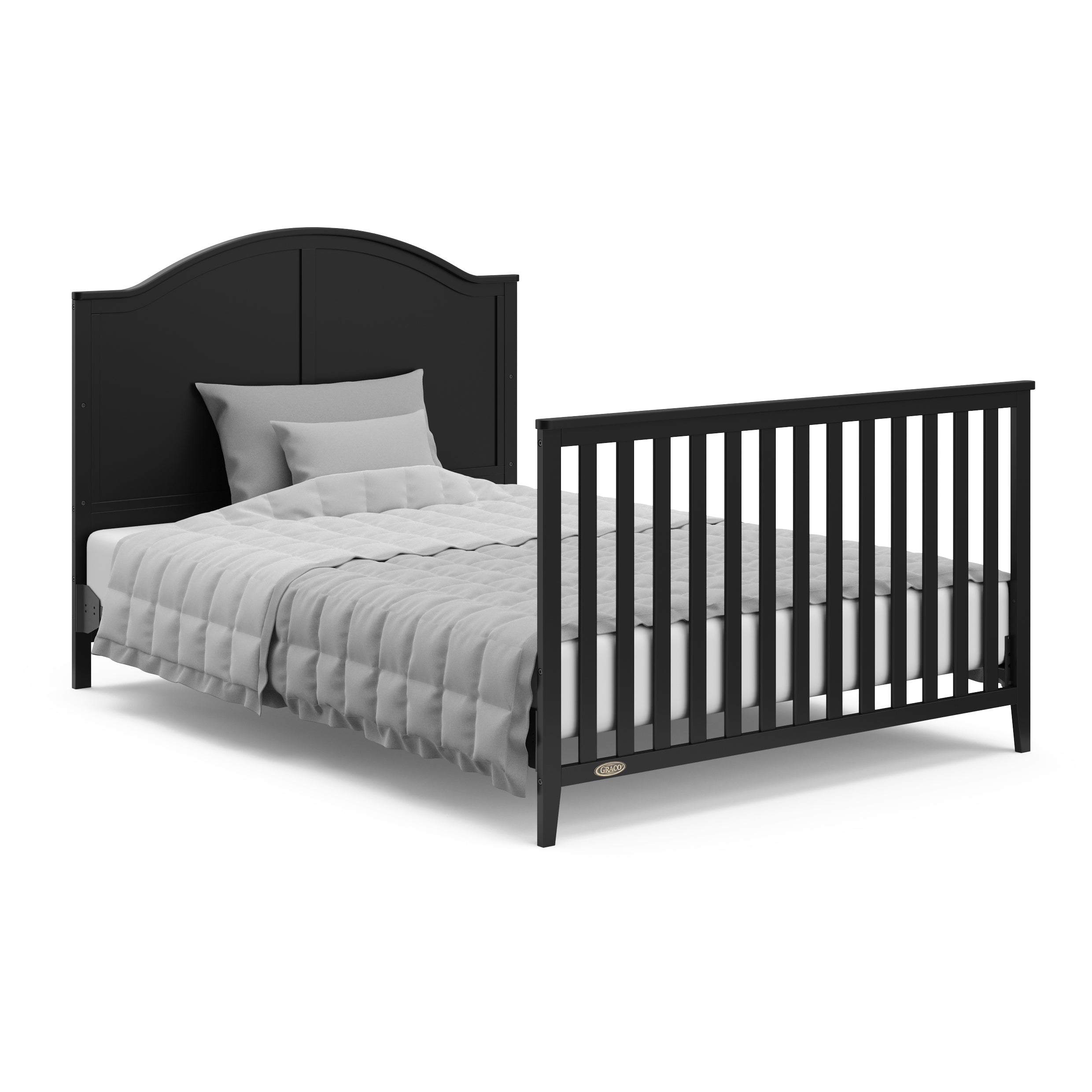 Black crib in full-size bed with headboard and footboard conversion