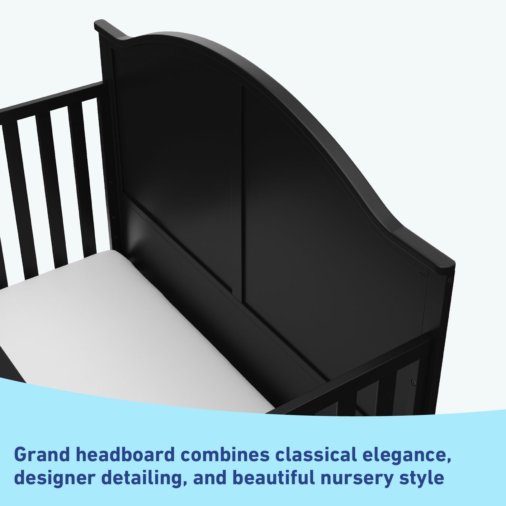 Close-up view of black crib's headboard graphic