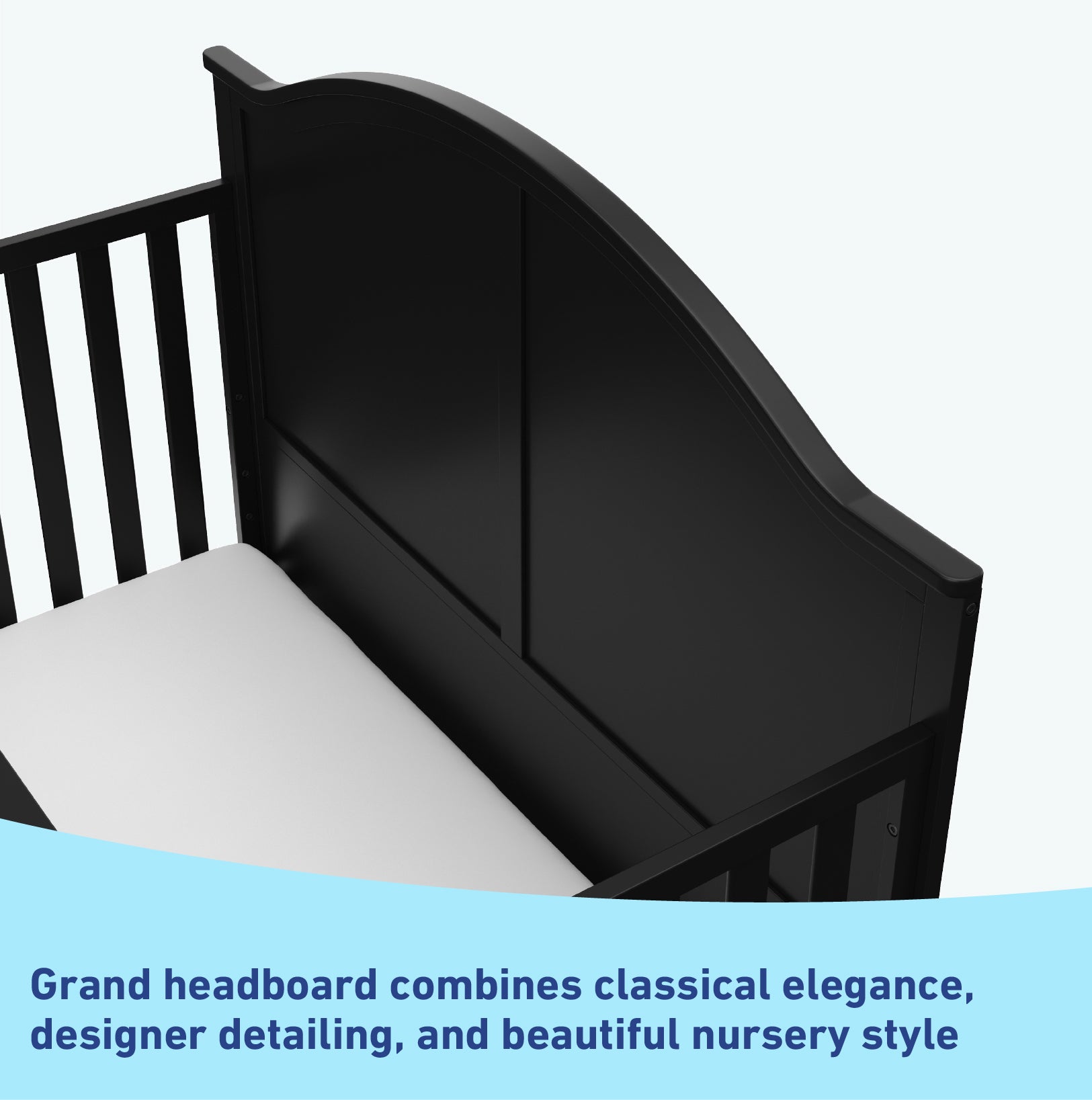 Close-up view of black crib's headboard graphic