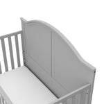 Close-up view of pebble gray crib's headboard