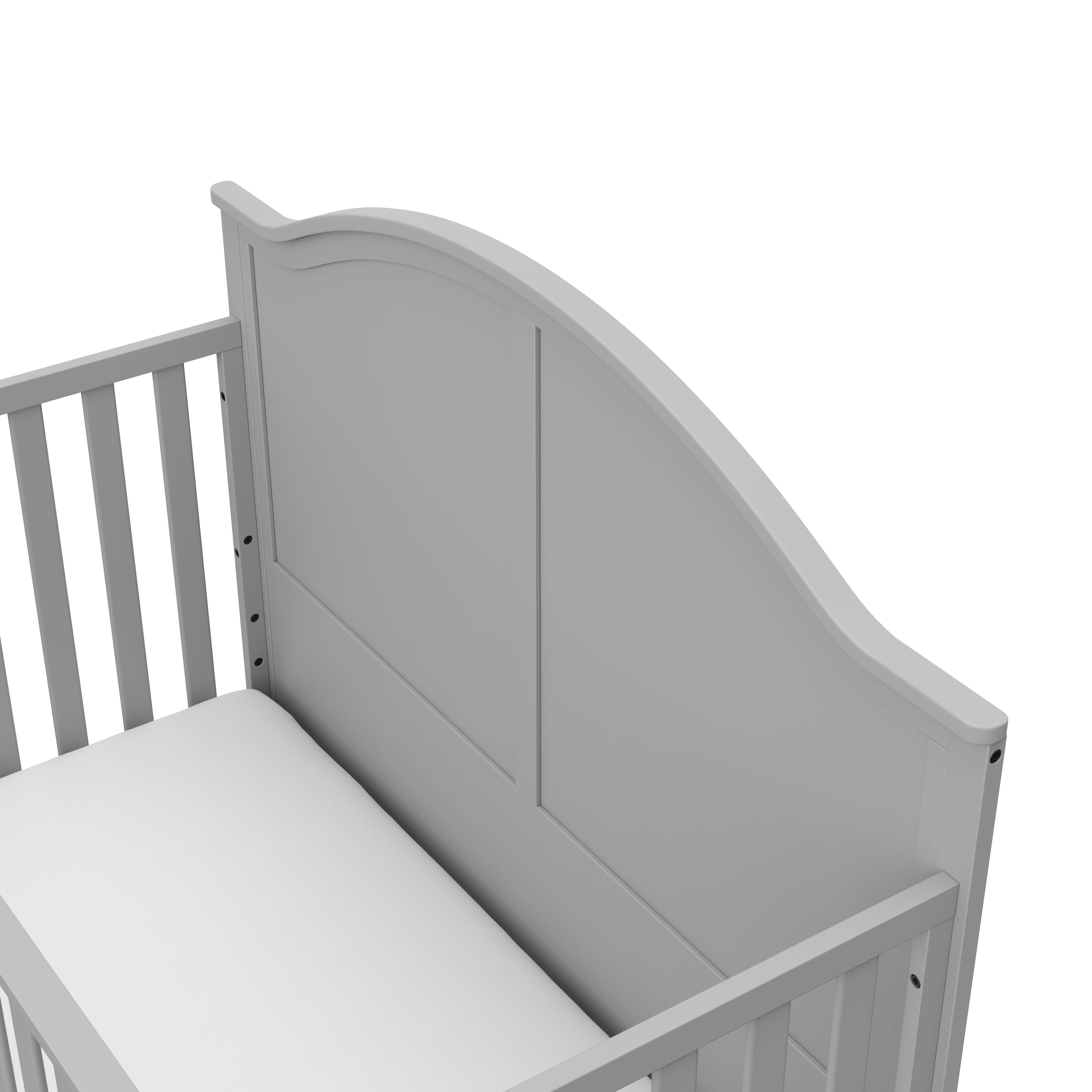 Close-up view of pebble gray crib's headboard