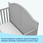 Close-up view of pebble gray crib's headboard