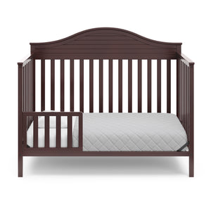 espresso in toddler bed conversion with one safety guardrail