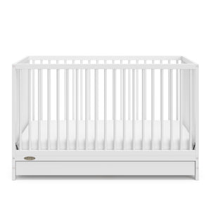 White crib with drawer angled