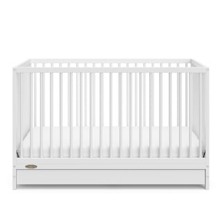 White crib with drawer angled