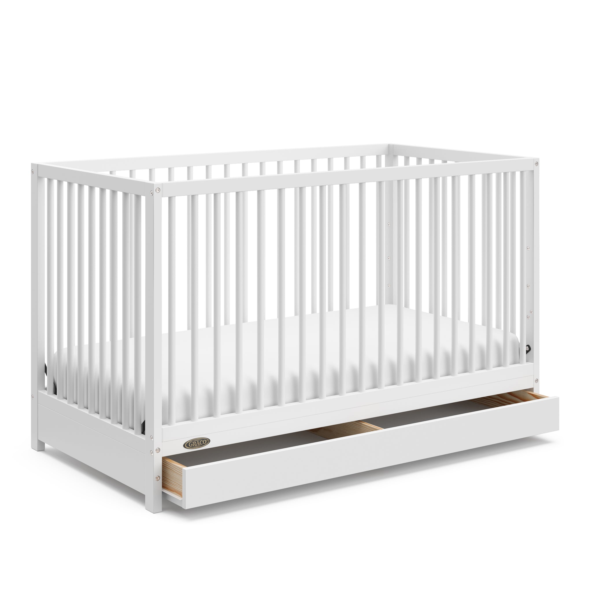 White crib with open drawer angled