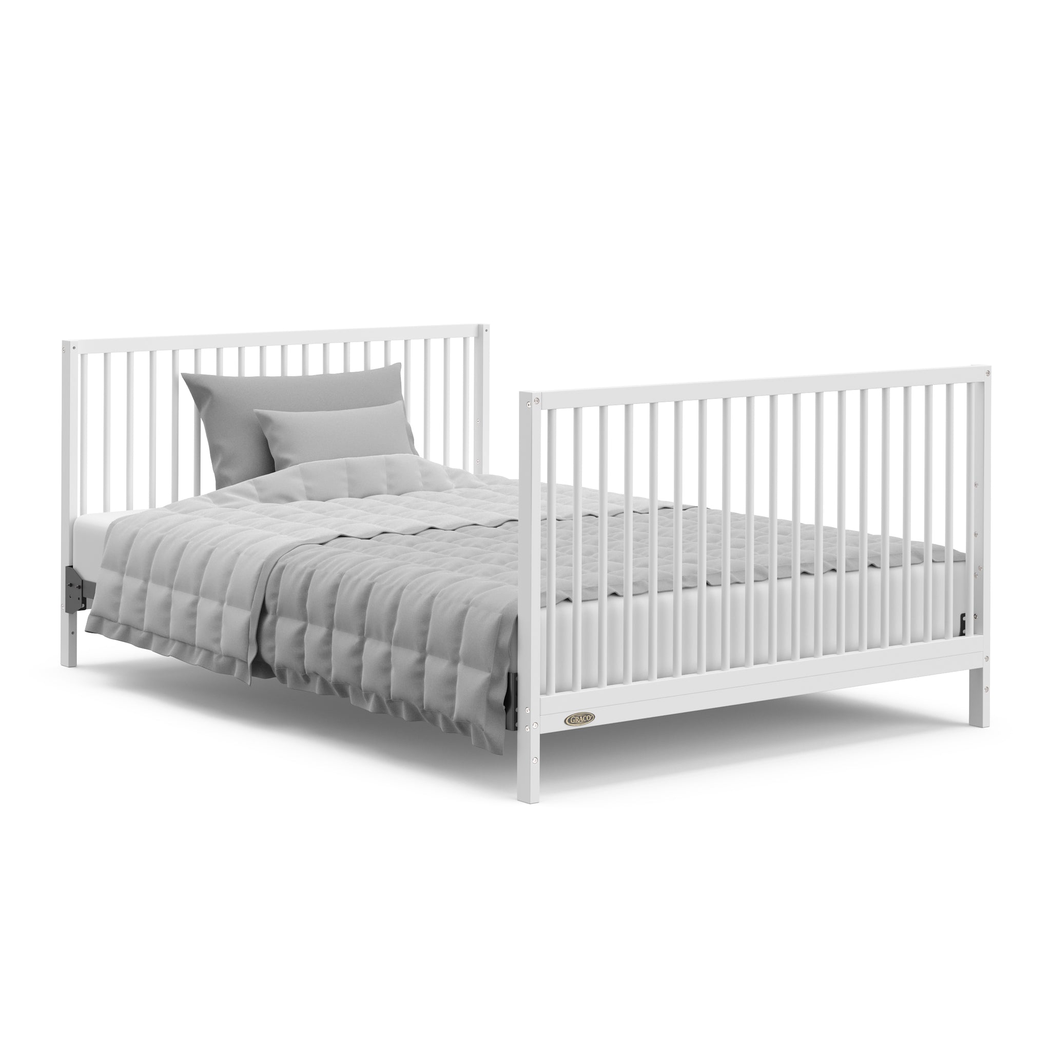 White crib with drawer in full-size bed with headboard and footboard conversion