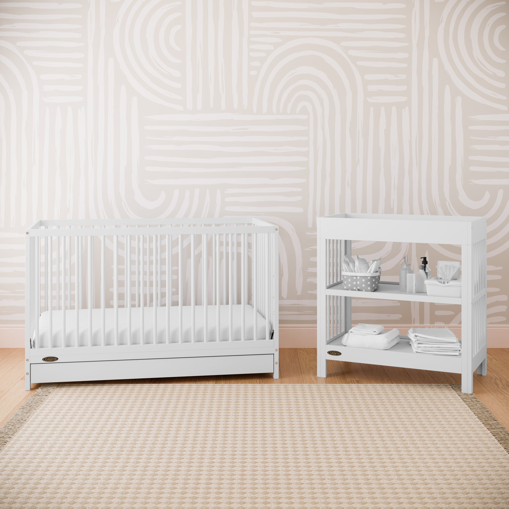White crib with drawer in nursery