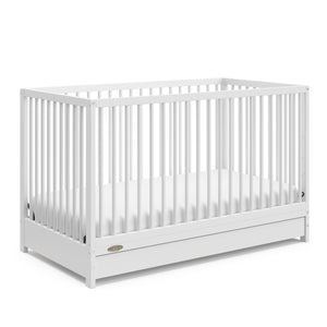 White crib with drawer angled