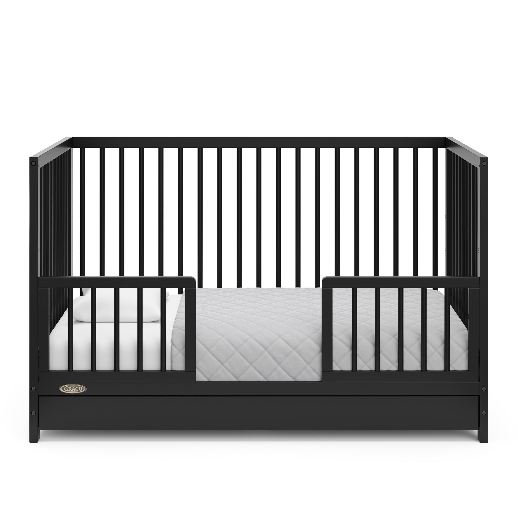 Black crib with drawer in toddler bed conversion with two safety guardrails