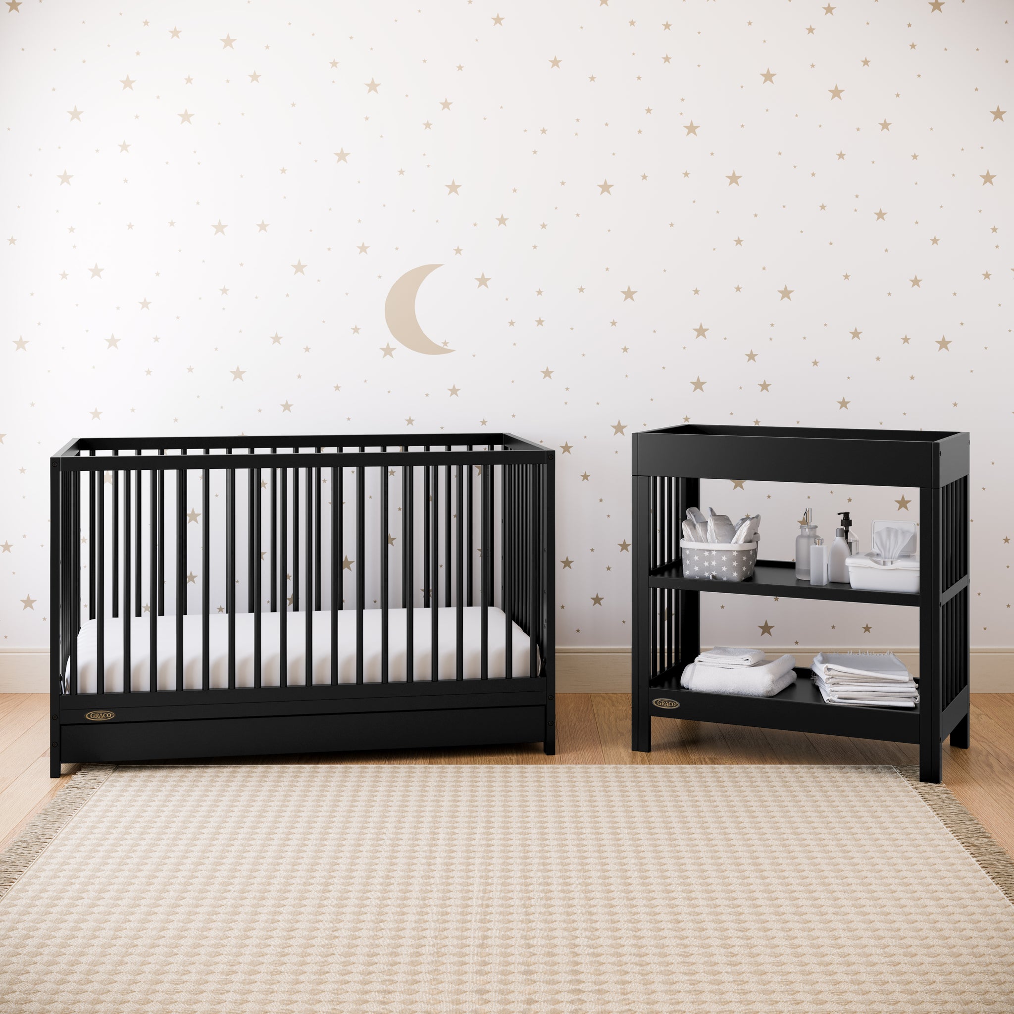 Black crib with drawer in nursery