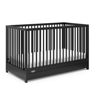 Black crib with drawer angled