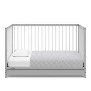 Pebble gray with white crib with drawer in toddler bed conversion