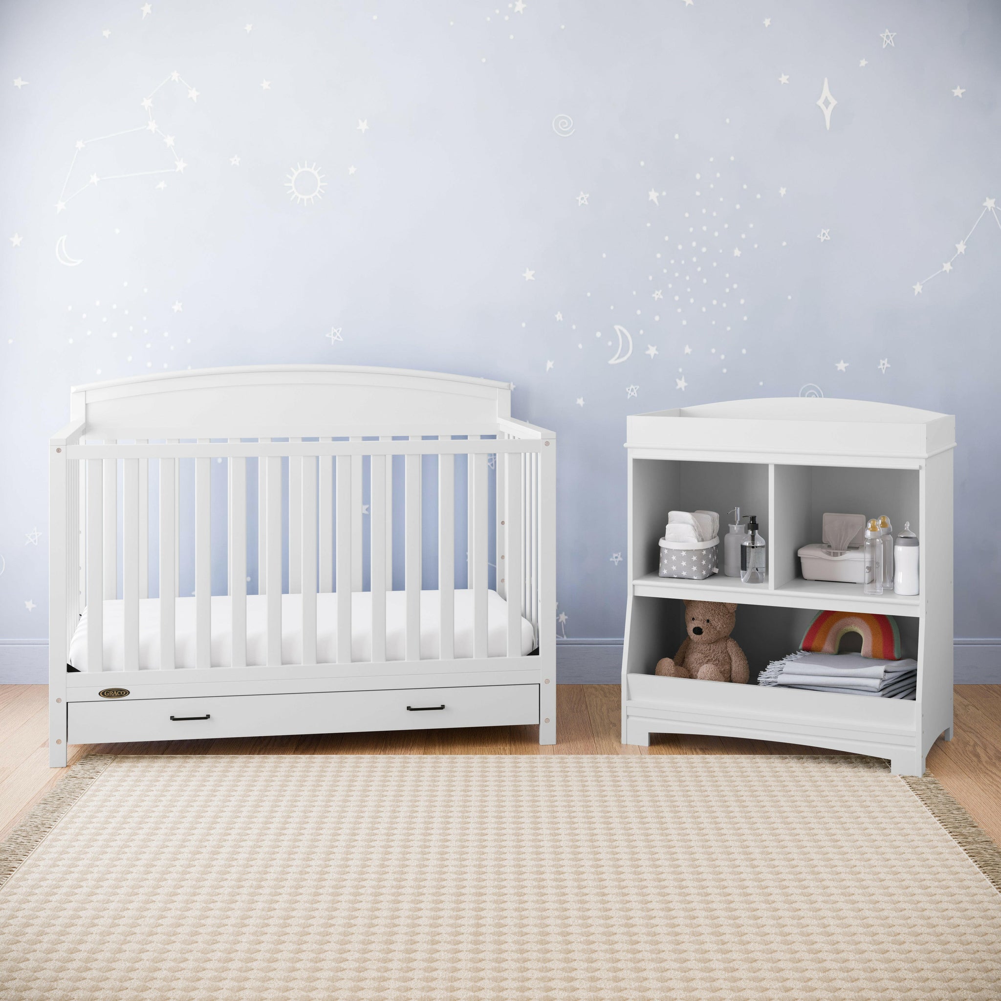 White changing table with storage in nursery 