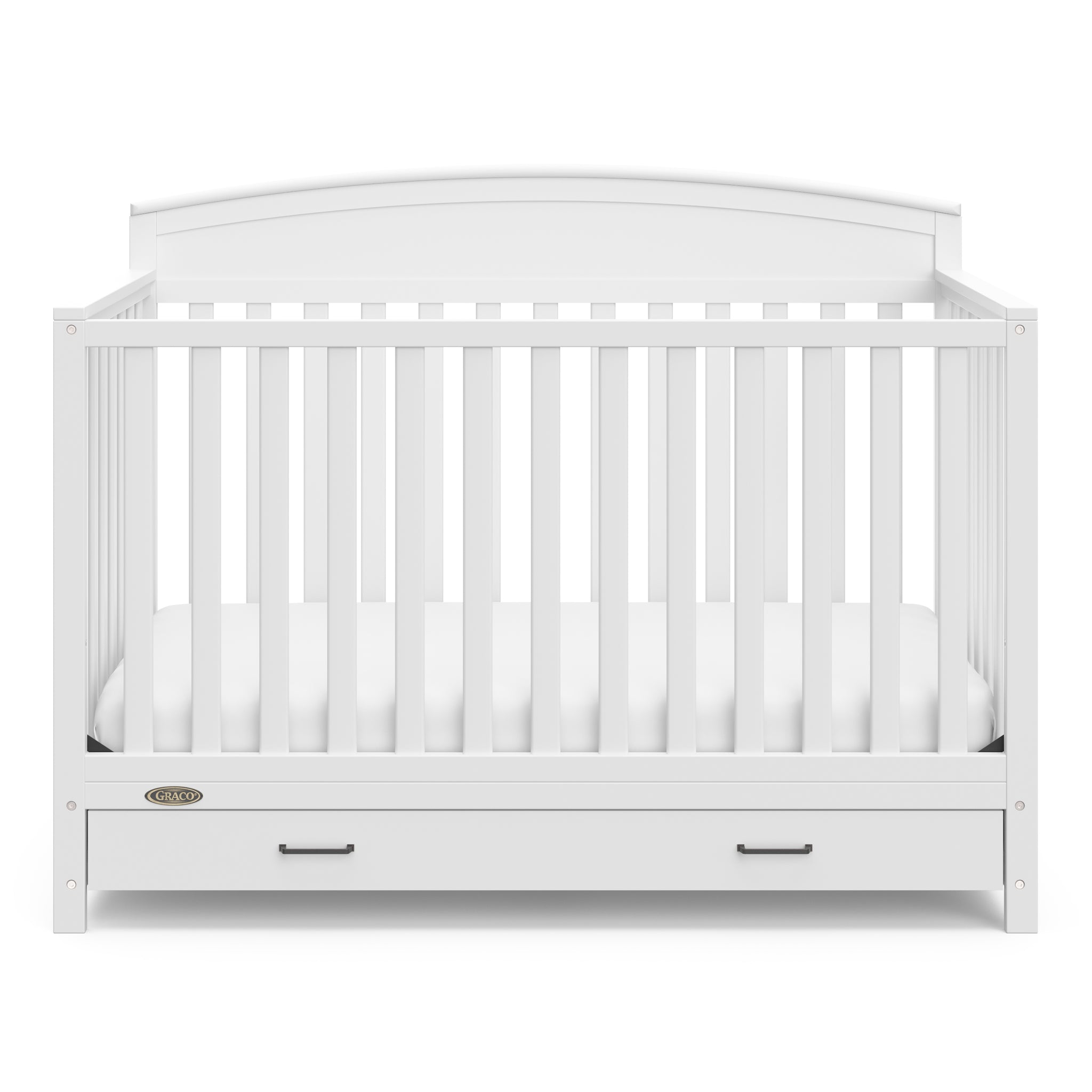 Front view of white crib with drawer