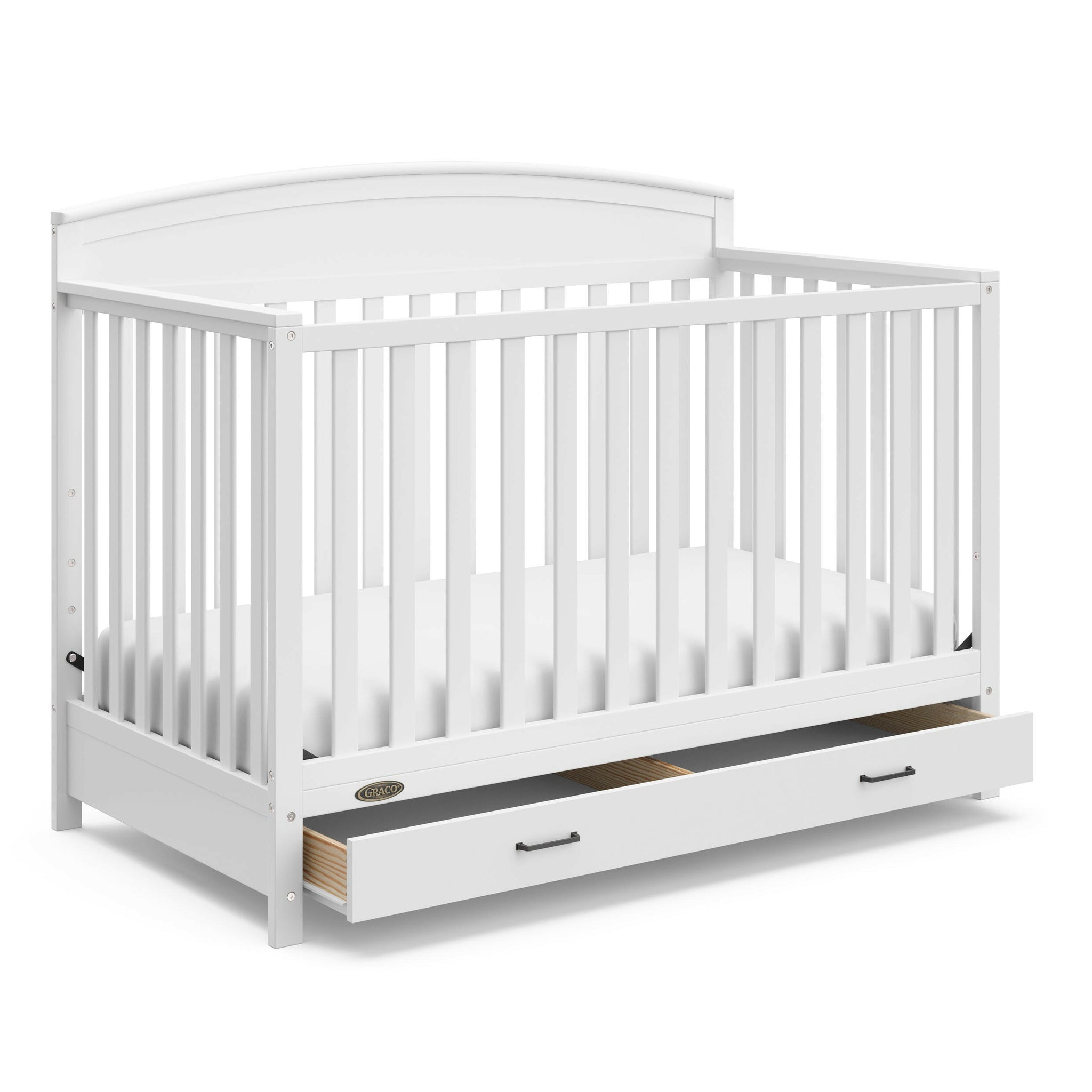 White crib with open drawer angled