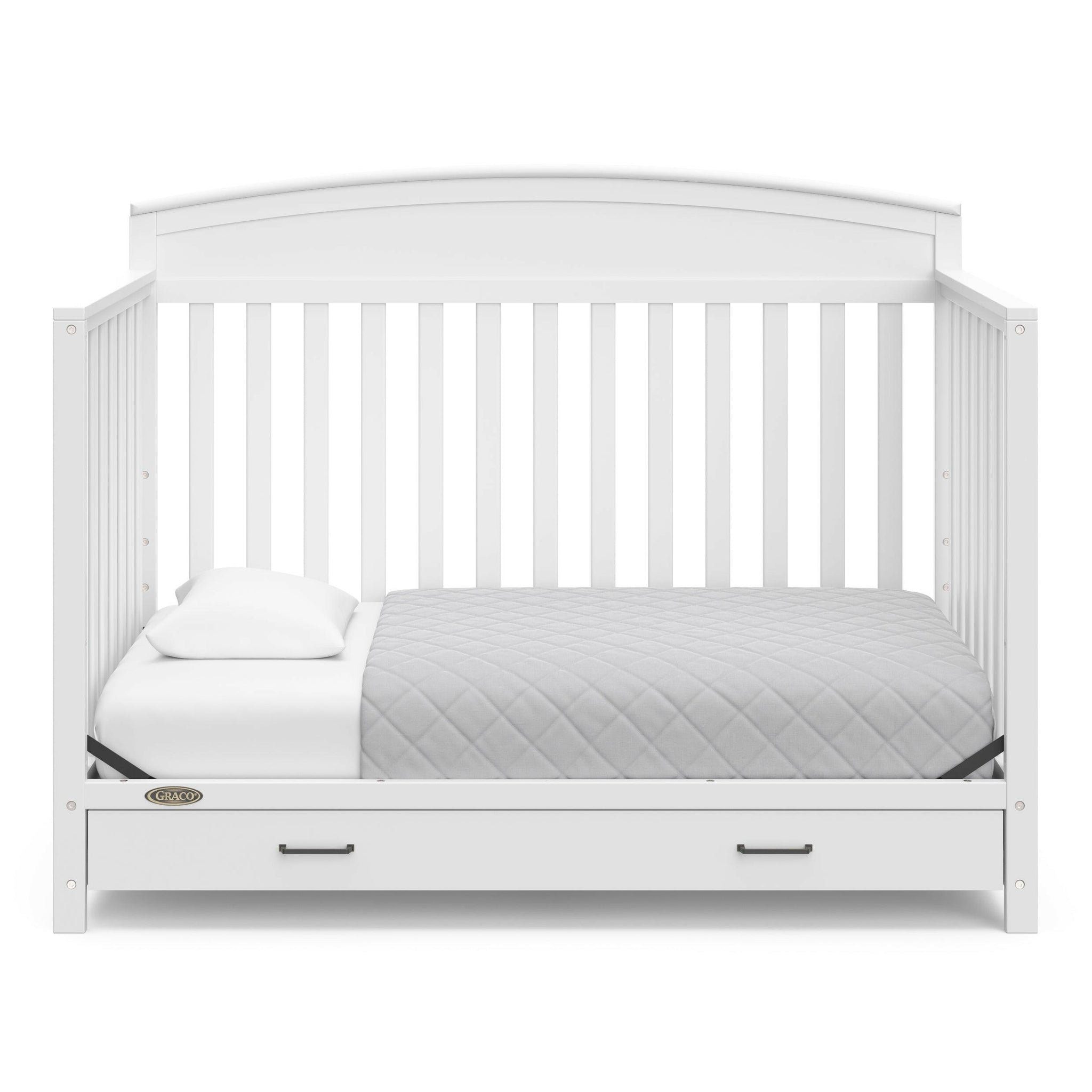 White crib with drawer in toddler bed conversion