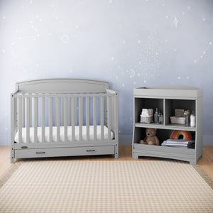 Pebble gray crib with drawer in nursery