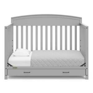 Pebble gray crib with drawer in toddler bed conversion