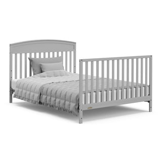 Pebble gray crib with drawer in full-size bed with headboard and footboard conversion