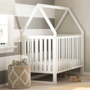 White crib in nursery 