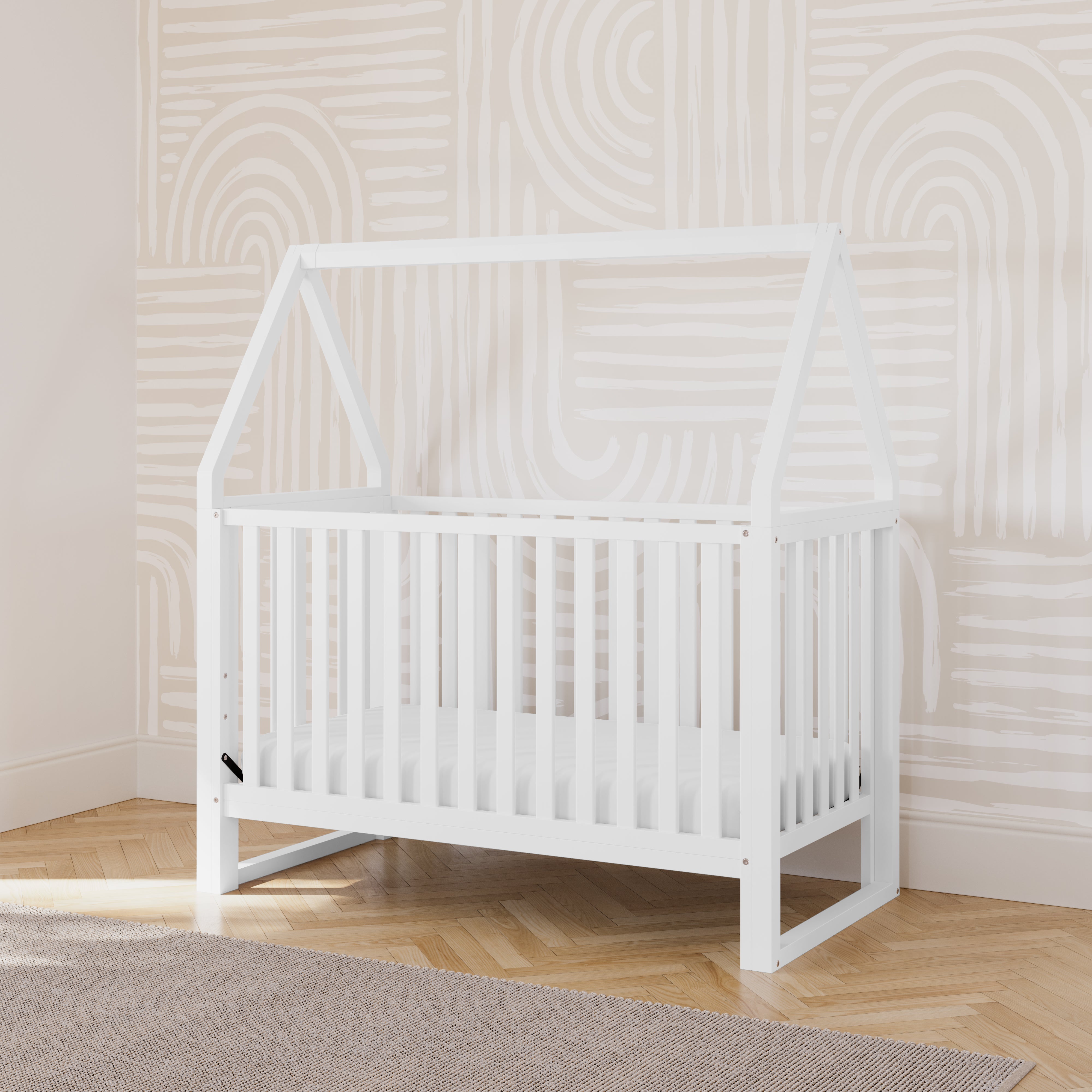 white convertible canopy crib in nursery