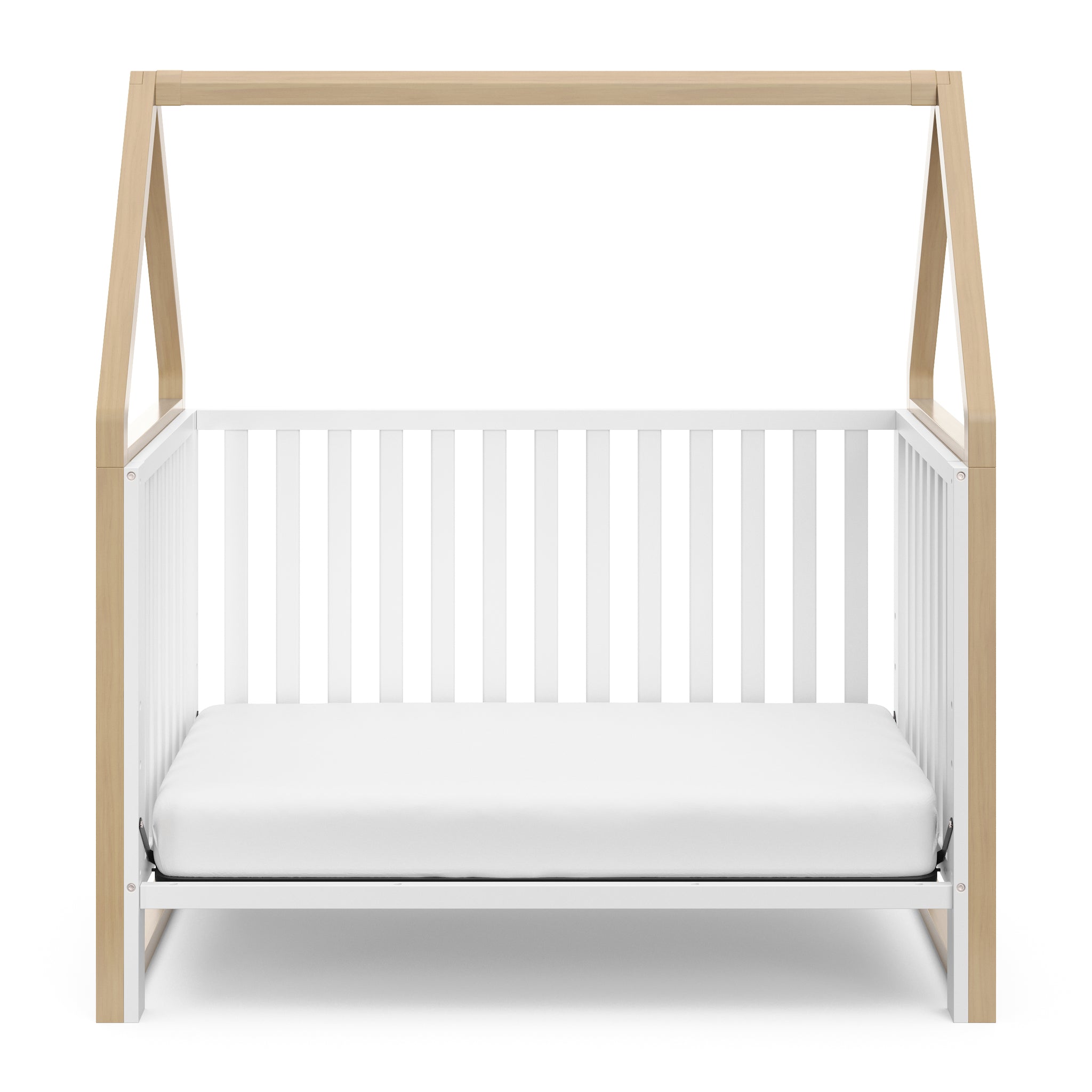 White crib with driftwood in toddler bed conversion 