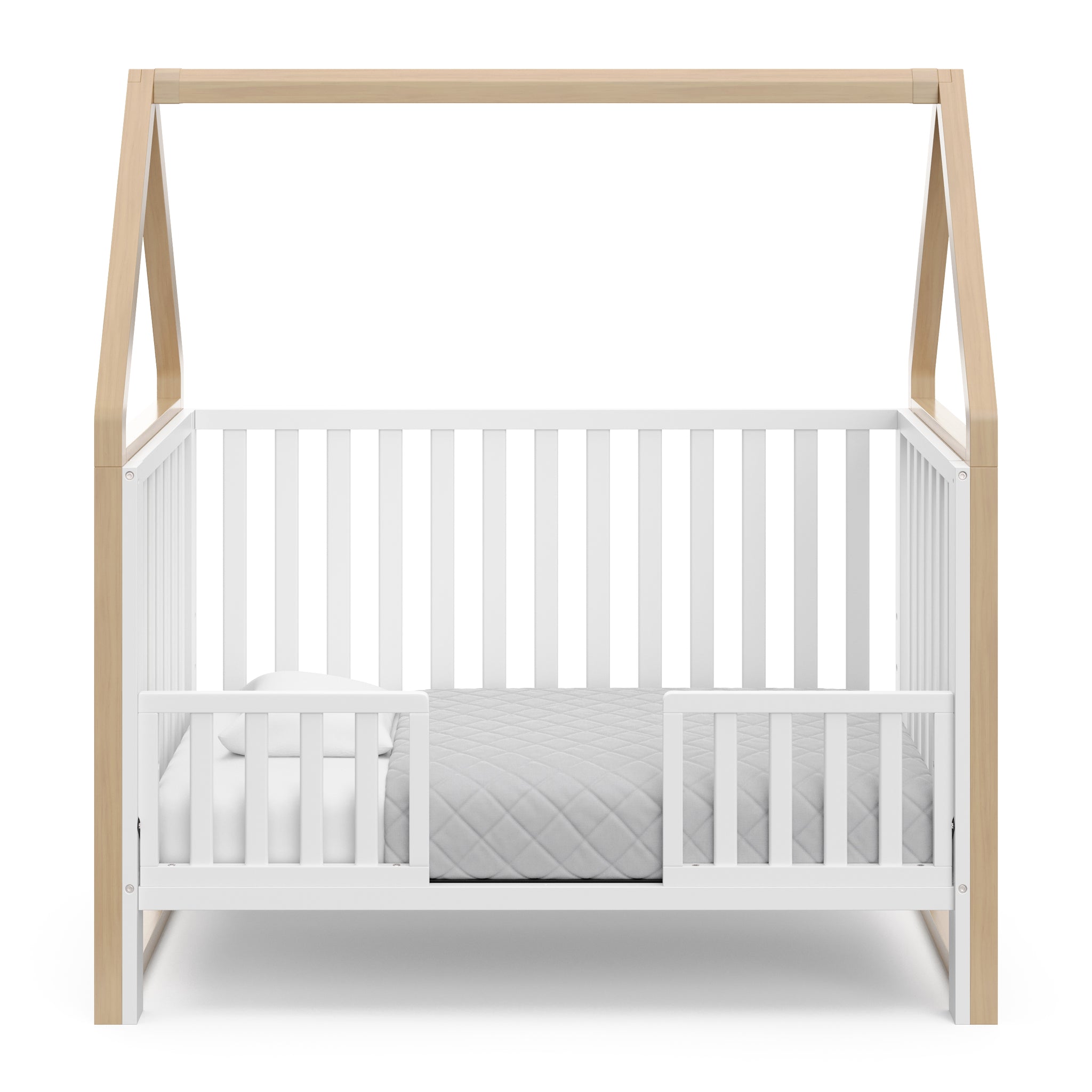 White crib with driftwood in toddler bed conversion with two safety guardrails 
