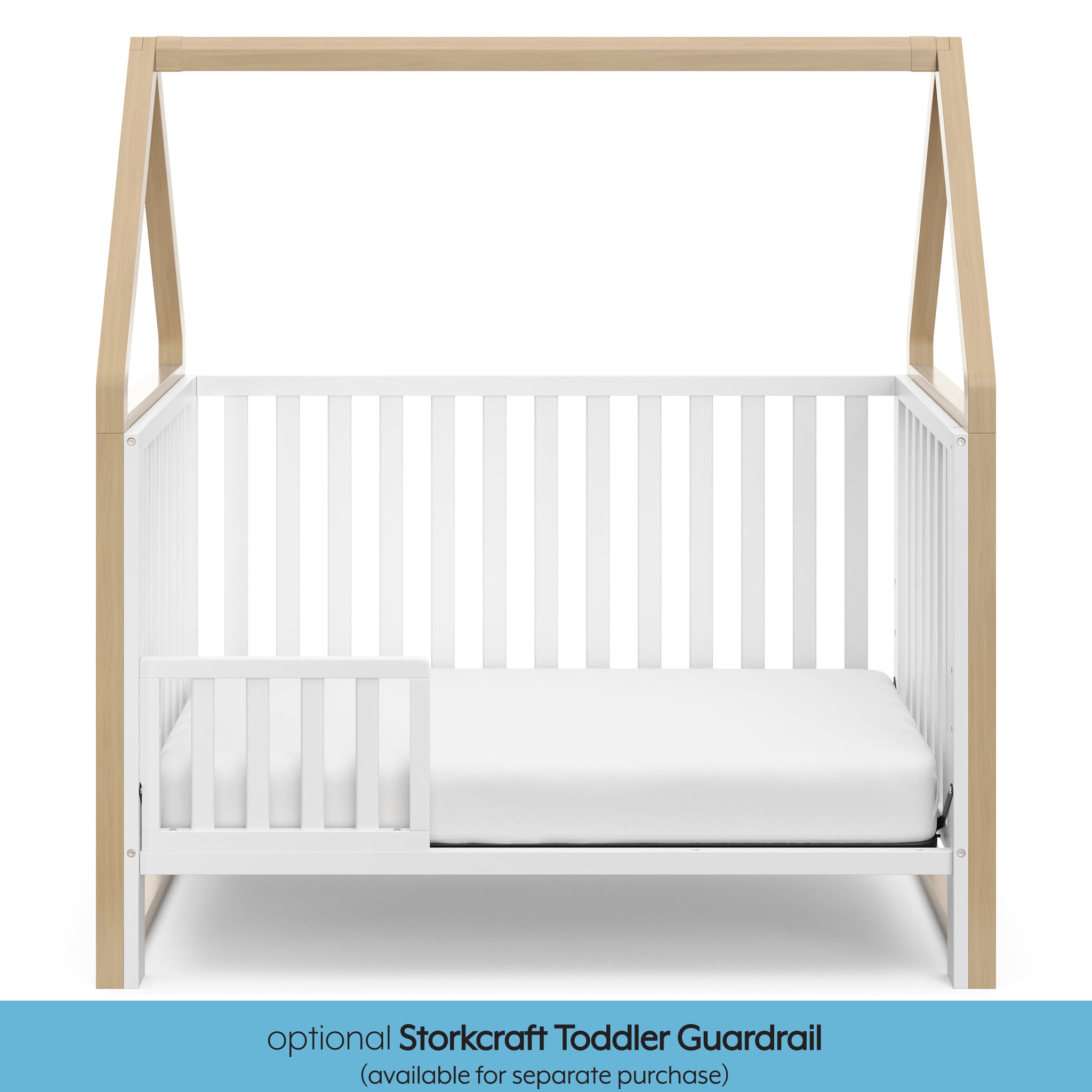 White crib with driftwood in toddler bed conversion with one safety guardrail graphic