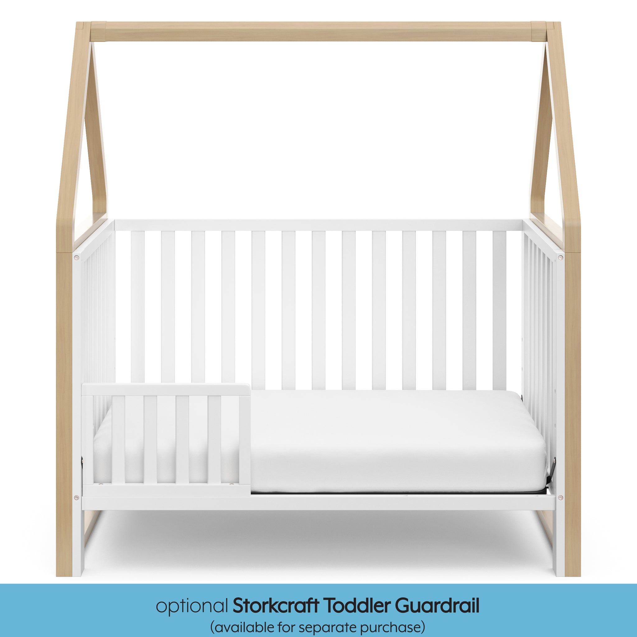 White crib with driftwood in toddler bed conversion with one safety guardrail graphic