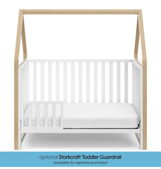 White crib with driftwood in toddler bed conversion with one safety guardrail graphic