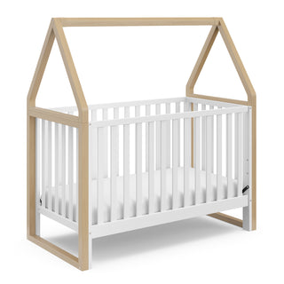 white crib with driftwood angled 