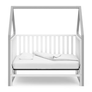 White crib with pebble gray in day bed conversion 